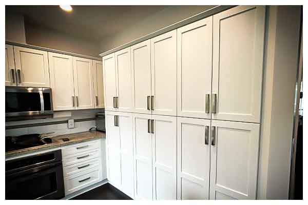 Custom white cabinets with silver handles