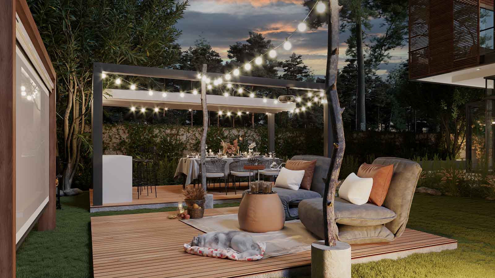 Gorgeous patio at night with edison light bulbs across it and soft furniture for watching an outdoor movie.