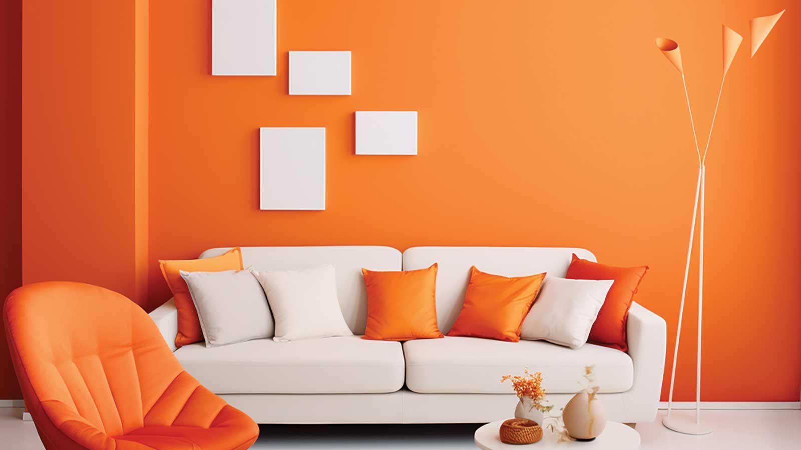Spring Pastels and Autumn Hues: Paint Color Trends That Celebrate the Seasons A modern living room with a bold orange accent wall and vibrant decor, embracing the Spring Pastels and Autumn Hues trend. Create a warm, inviting space with professional painting by Roarty Painting.