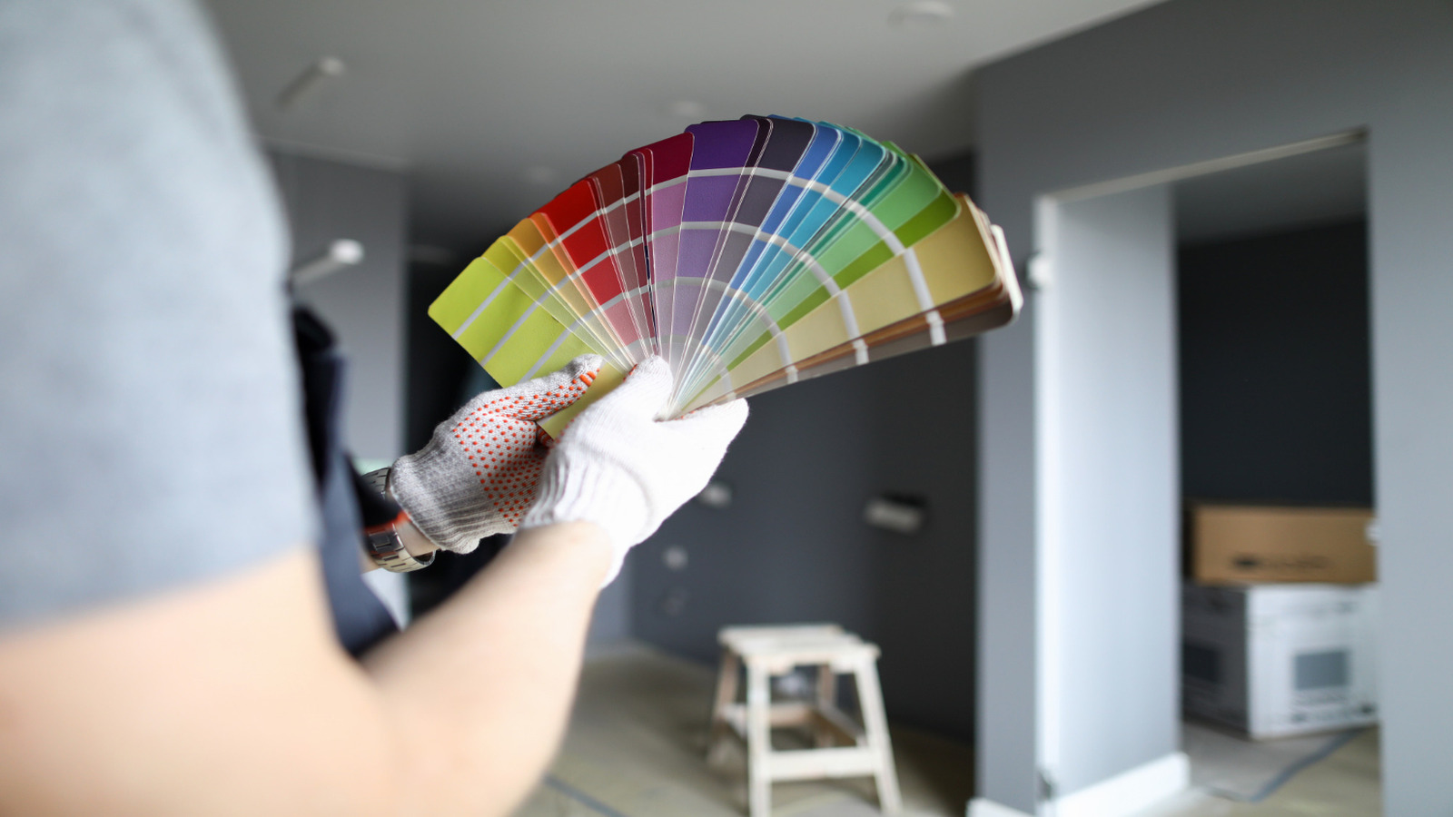 Roarty Painting explores Warm Tones vs Cool Tones: What Works Best in Vancouver Homes with a fan of swatches in a sleek, modern renovation setting.